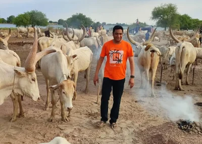Dinka community members and cattle during a cultural tour in South Sudan